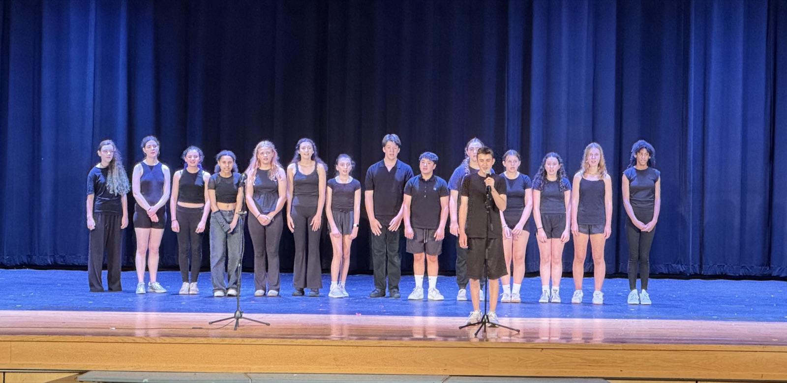 Teen performers on stage at the showcase